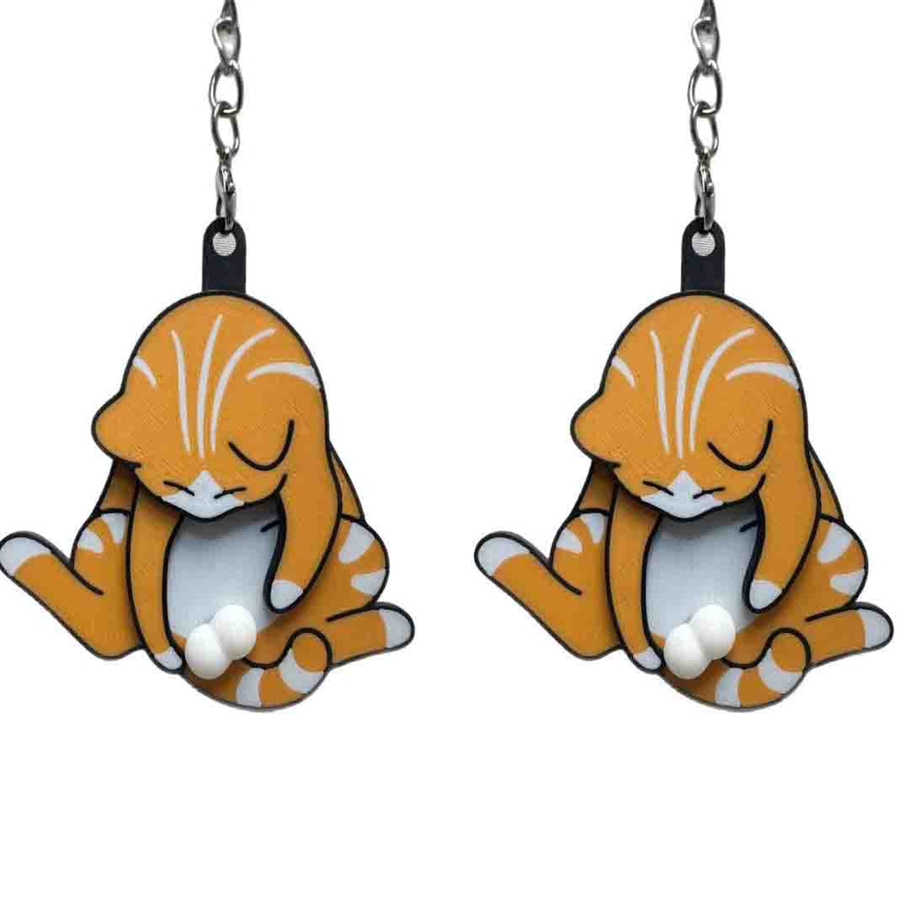 Playing with eggs and kitten keychain