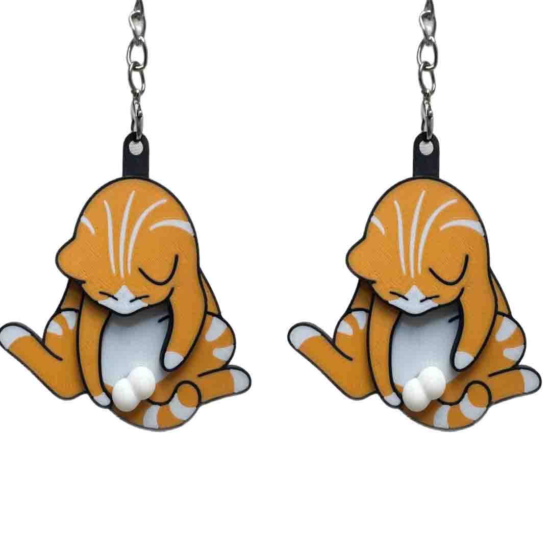 Playing with eggs and kitten keychain