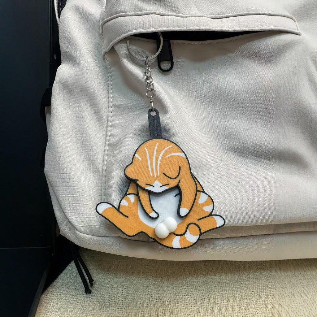 Playing with eggs and kitten keychain