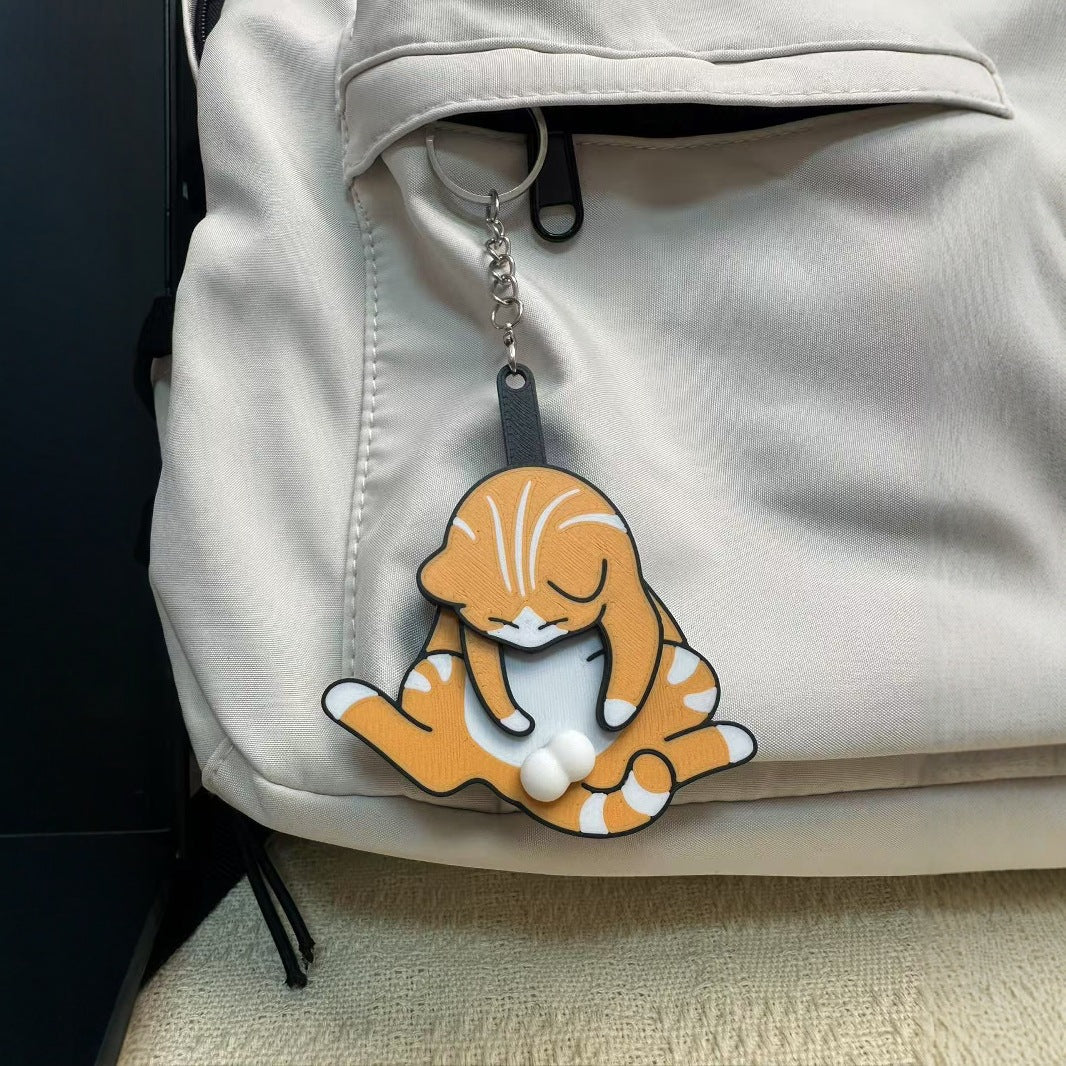 Playing with eggs and kitten keychain