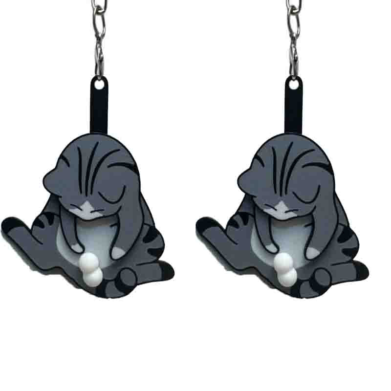 Playing with eggs and kitten keychain