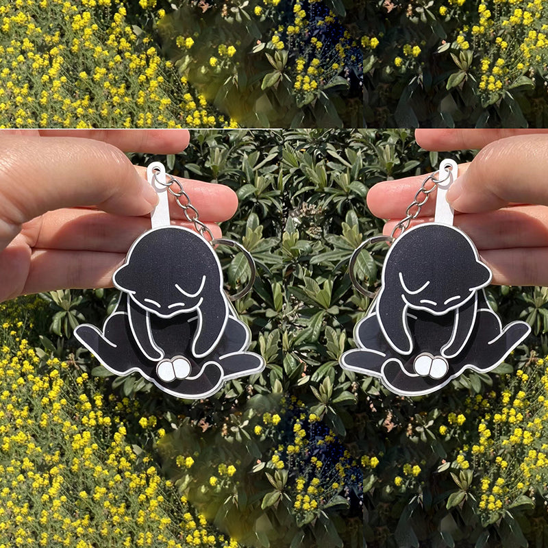 Playing with eggs and kitten keychain